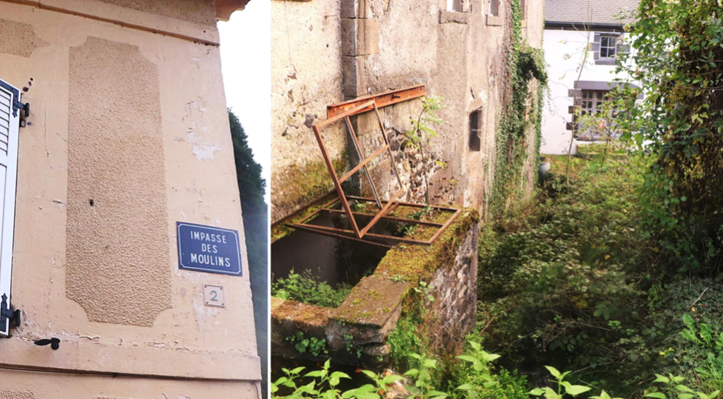 Un panneau "rue des Moulins" sur un mur et un vieux moulins en ruine